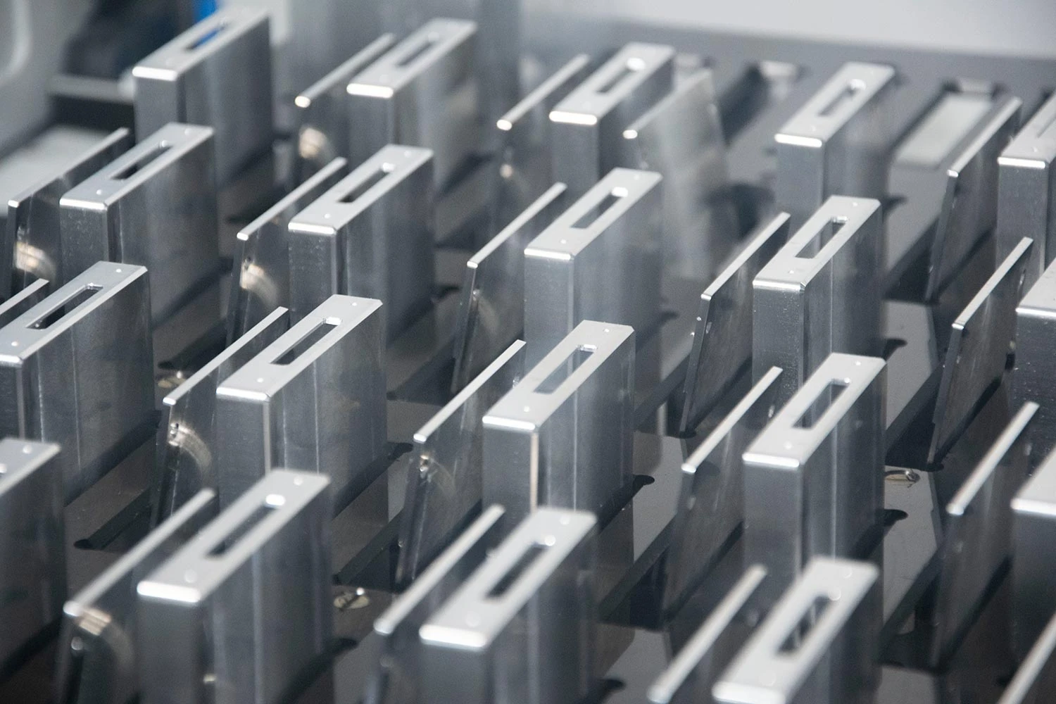 Machined brackets arranged in rows